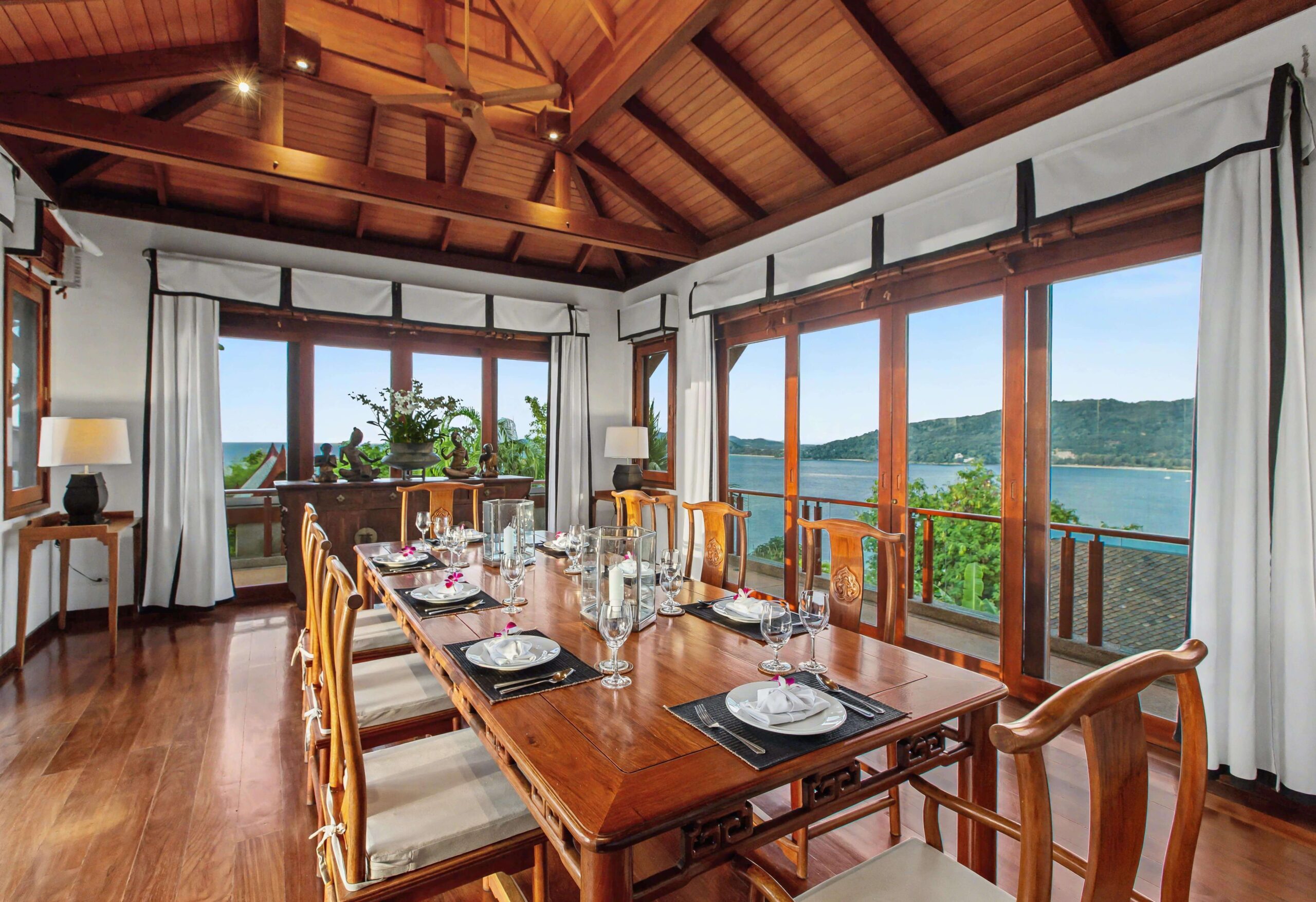 Indoor Oceanview Dining Room  Elegant indoor dining with panoramic sea views  Seating for up to 12 guests
